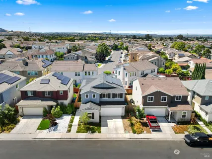 an aerial view of residential houses with outdoor space