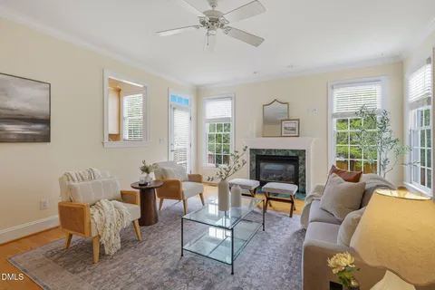 a kitchen with stainless steel appliances granite countertop a stove a sink dishwasher a refrigerator and a microwave oven with wooden floor