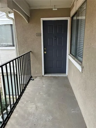 a view of a hallway with entryway door