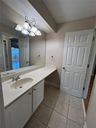 a bathroom with a sink a vanity and a mirror