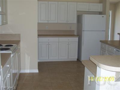 1820 Ridgemoor Street Lehigh Acres, FL 33972 - Photo 3 of 6 a view of storage and utility room with washer and dryer