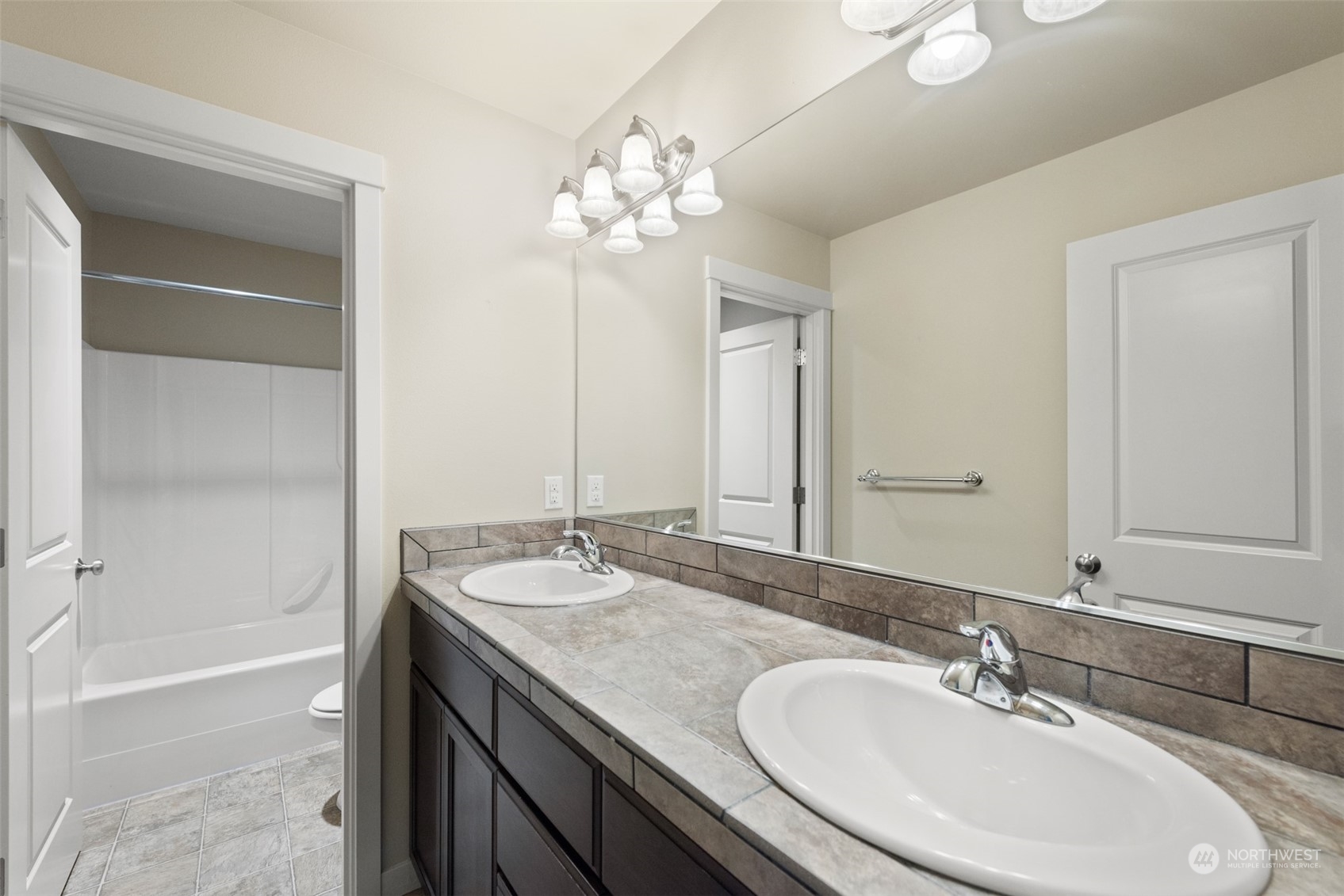 3530 215th Place Southeast Bothell, WA 98021 - Photo 27 of 35 a bathroom with a granite countertop sink a toilet and shower