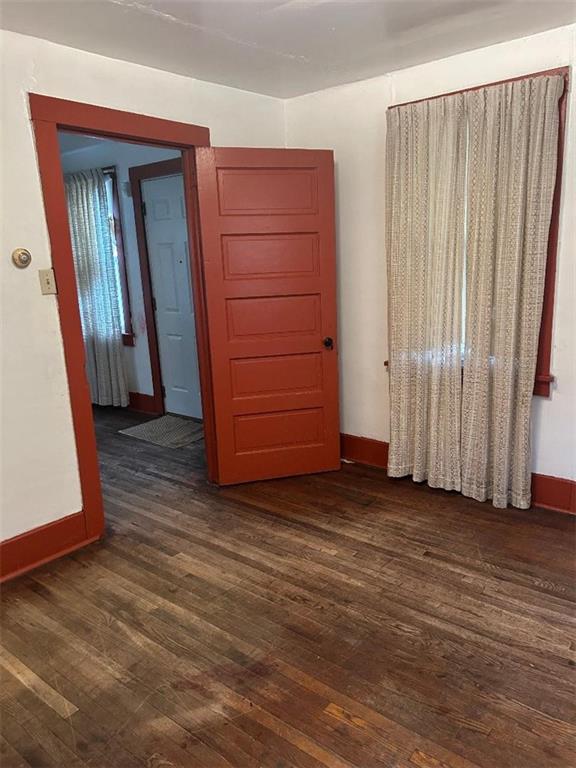204 2nd Street Trafford, PA 15085 - Photo 11 of 13 an empty room with wooden floor and cabinet