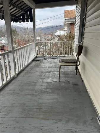 a view of a porch with a bench