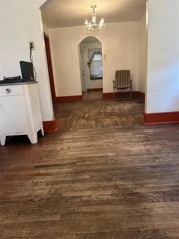a living room with furniture and a mirror