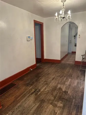 a view of a livingroom with wooden floor