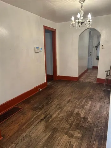 a view of a livingroom with wooden floor