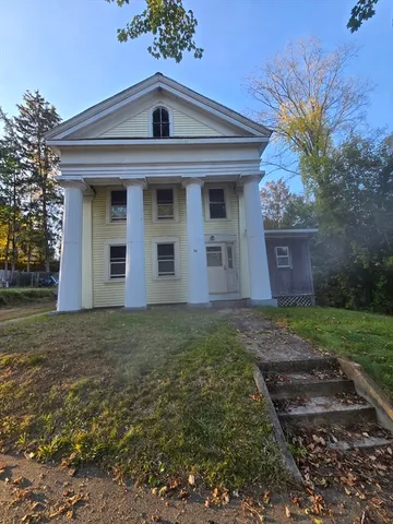 a view of a house with a yard