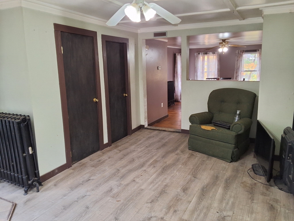 72 Maple Street Warren, MA 01083 - Photo 3 of 16 a living room with furniture and a wooden floor