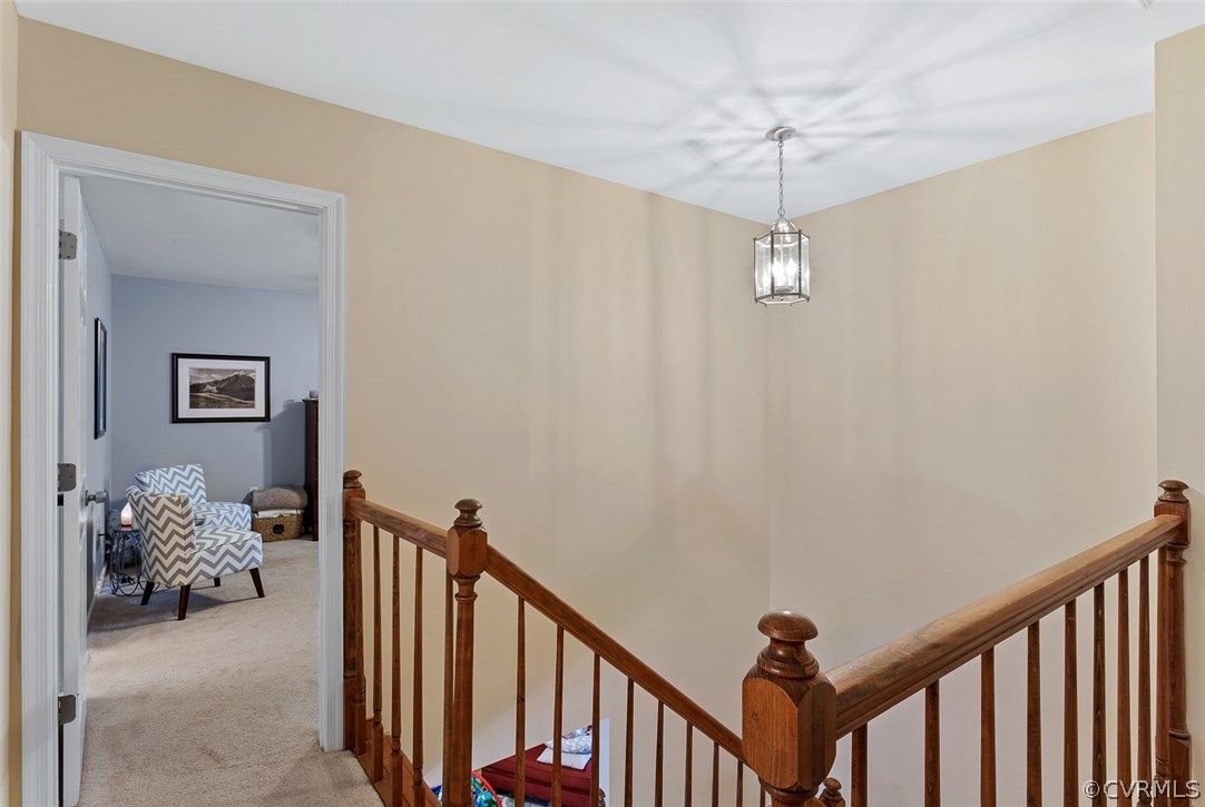 4409 Fordham Road Chesterfield, VA 23236 - Photo 16 of 27 a view of a hallway with windows and chandelier fan