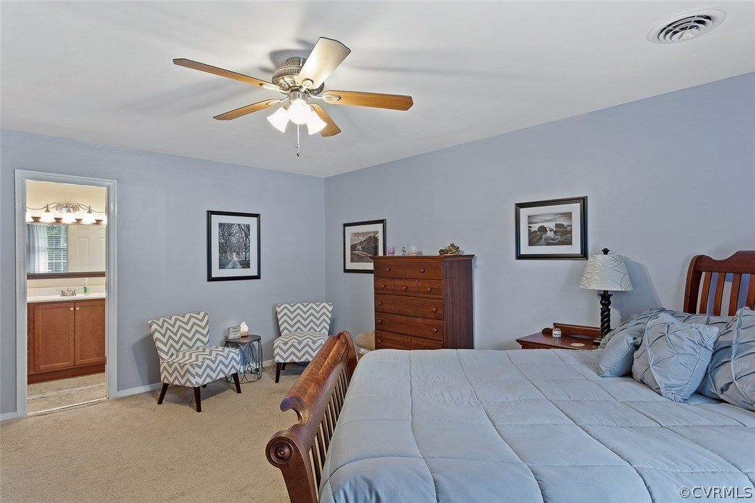 4409 Fordham Road Chesterfield, VA 23236 - Photo 18 of 27 a bedroom with a bed and a chandelier