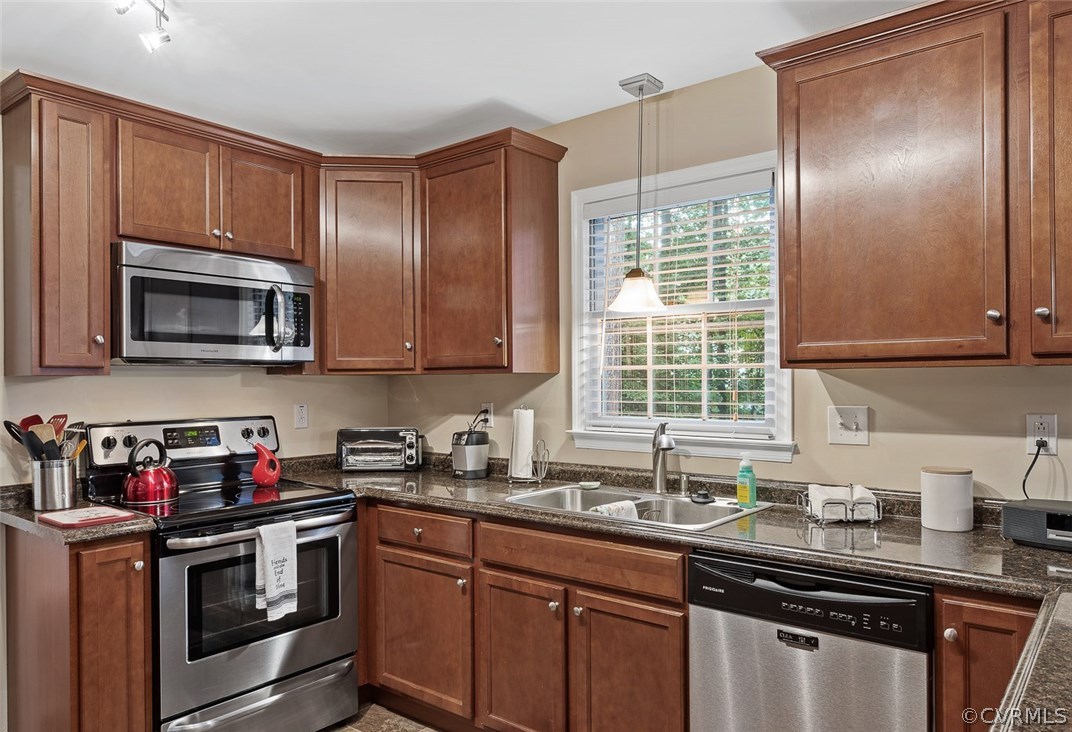 4409 Fordham Road Chesterfield, VA 23236 - Photo 9 of 27 a kitchen with stainless steel appliances granite countertop a sink stove and microwave