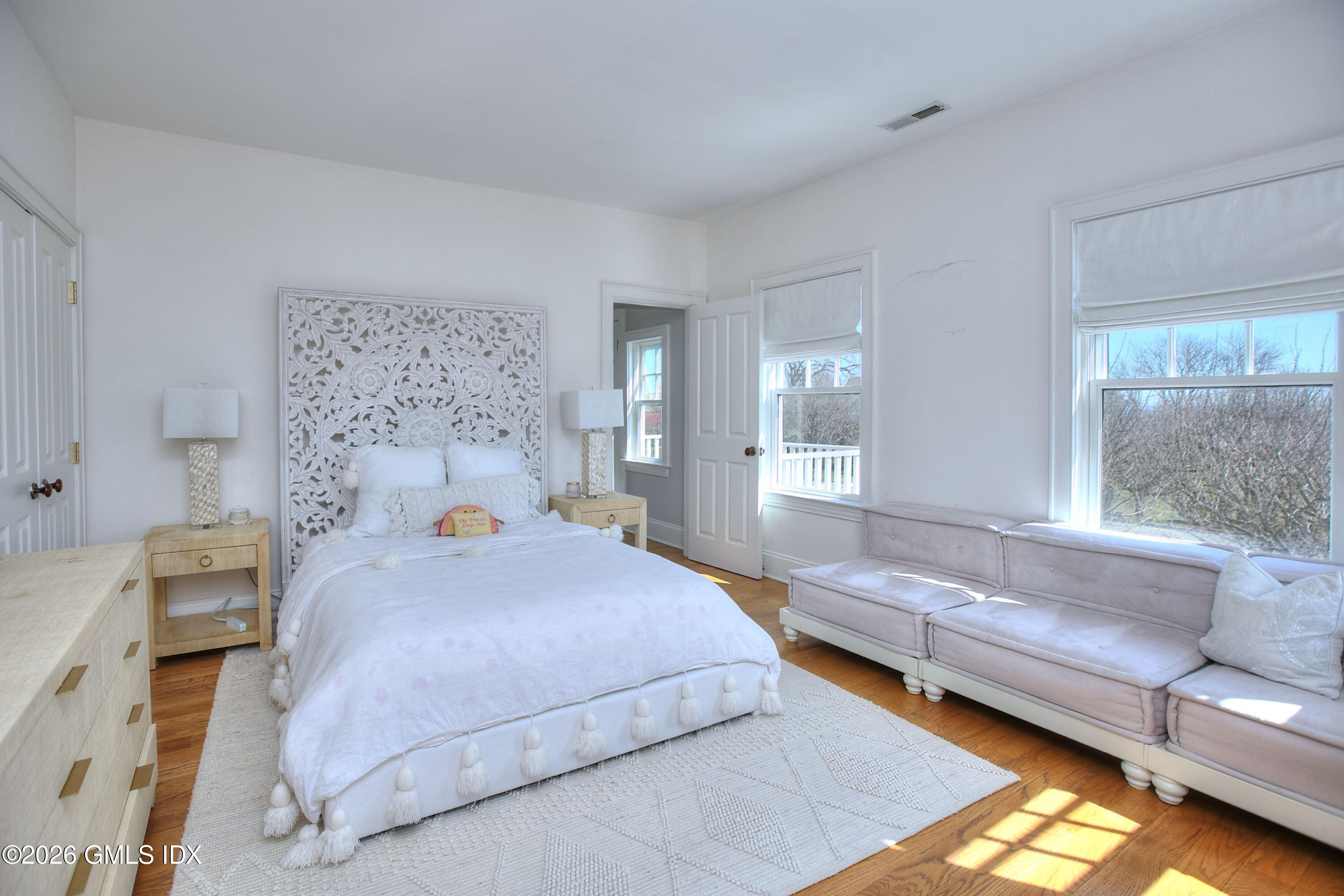 3 Shorehaven Road Norwalk, CT 06855 - Photo 30 of 40 a bedroom with a bed couch and a window