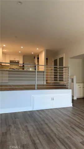 a view of kitchen and wooden floor