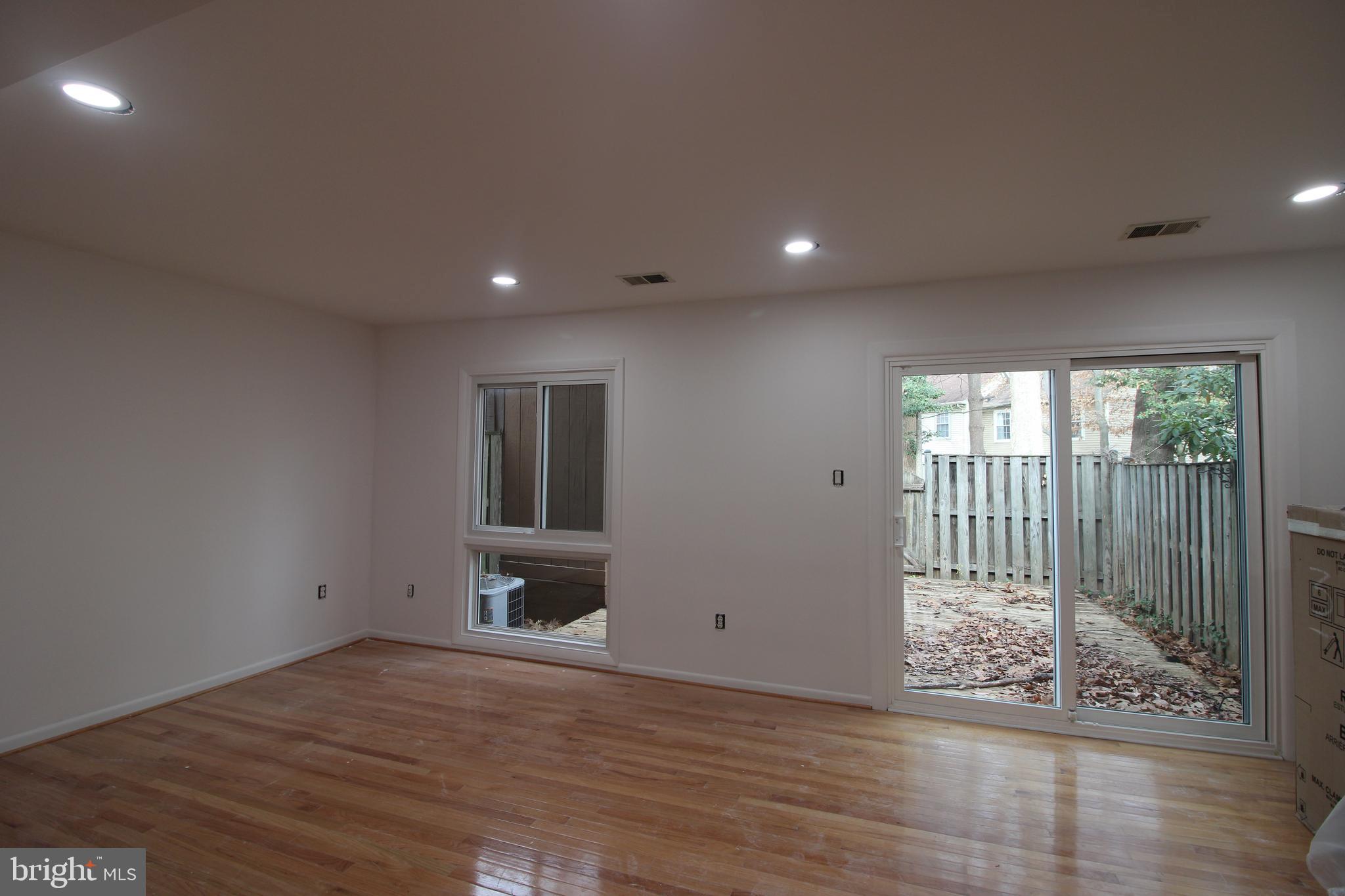 3007 Mission Square Drive Fairfax, VA 22031 - Photo 5 of 13 an empty room with wooden floor and windows
