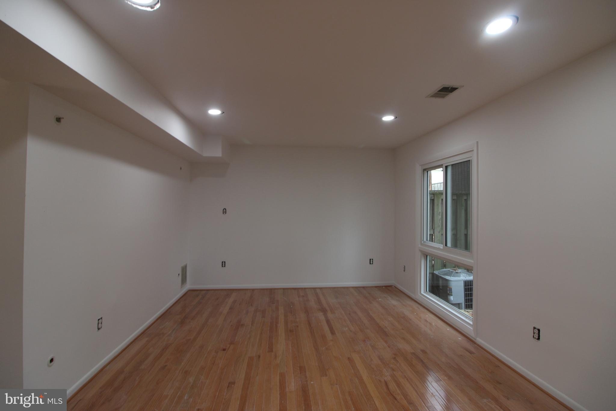 3007 Mission Square Drive Fairfax, VA 22031 - Photo 6 of 13 an empty room with wooden floor and windows