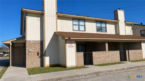 a front view of a house with a garage