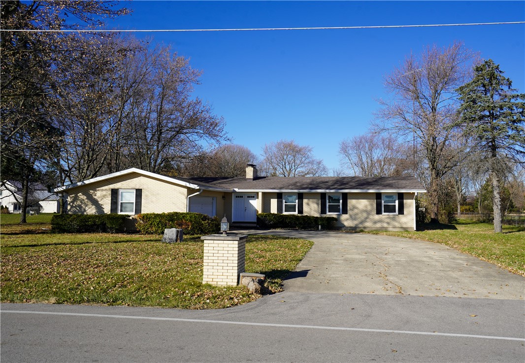 8746 Grubbs-Rex Road Arcanum, OH 45304 - Photo 36 of 38 This charming home offers a spacious driveway and mature landscaping.