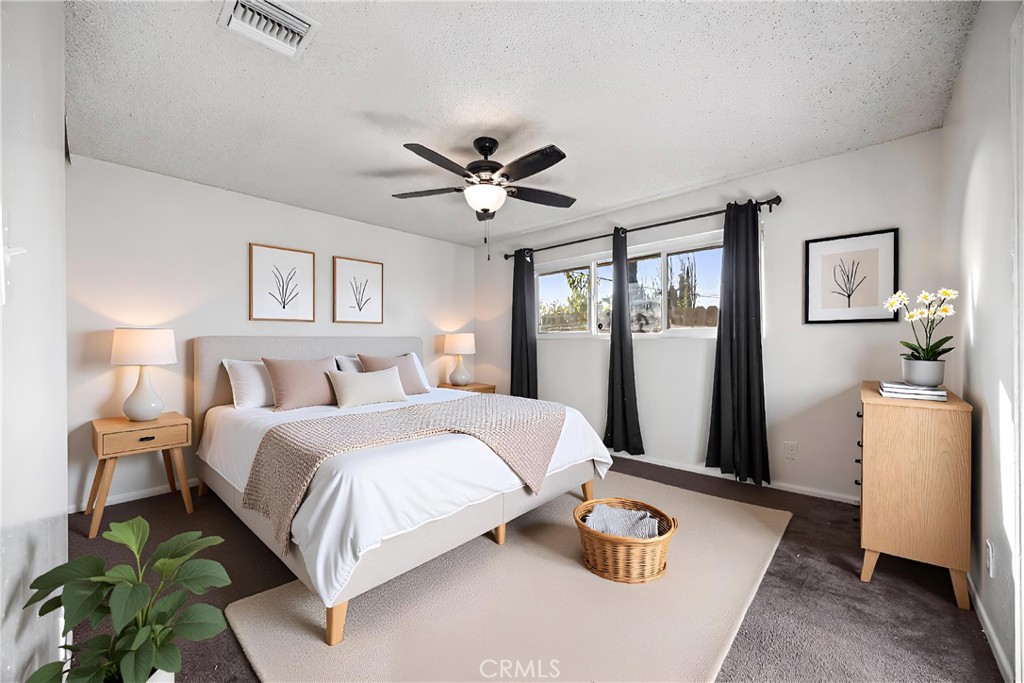 2520 14th Street Riverside, CA 92507 - Photo 11 of 17 a bedroom with a bed and a table