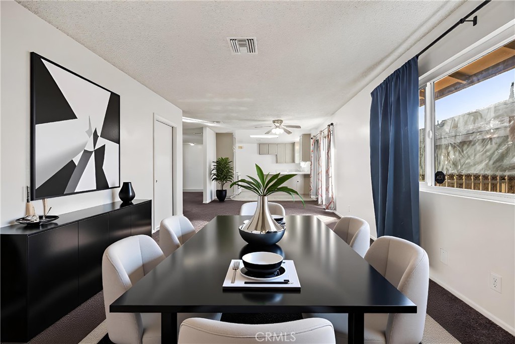 2520 14th Street Riverside, CA 92507 - Photo 4 of 17 a view of a dining room with furniture window and wooden floor