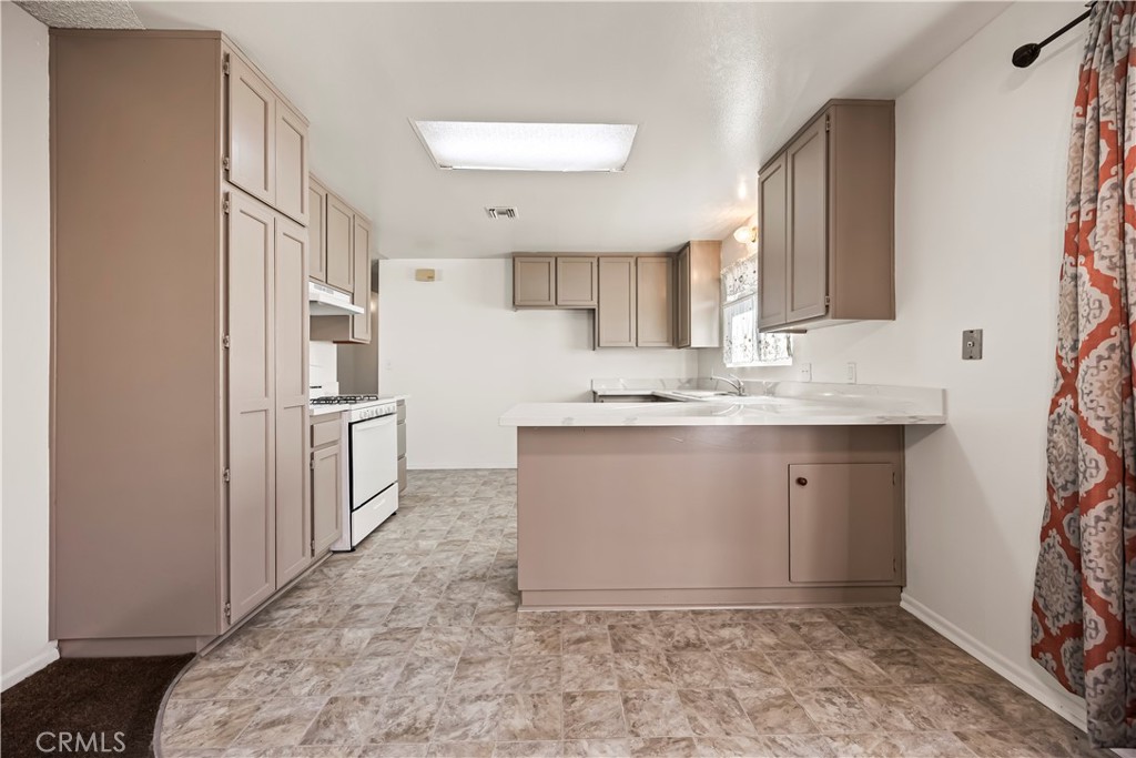 2520 14th Street Riverside, CA 92507 - Photo 8 of 17 a bathroom with a sink a mirror and a shower