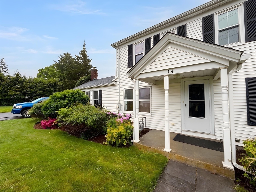 114 Curve Street Dedham, MA 02026 - Photo 2 of 27 a front view of house with yard and outdoor seating