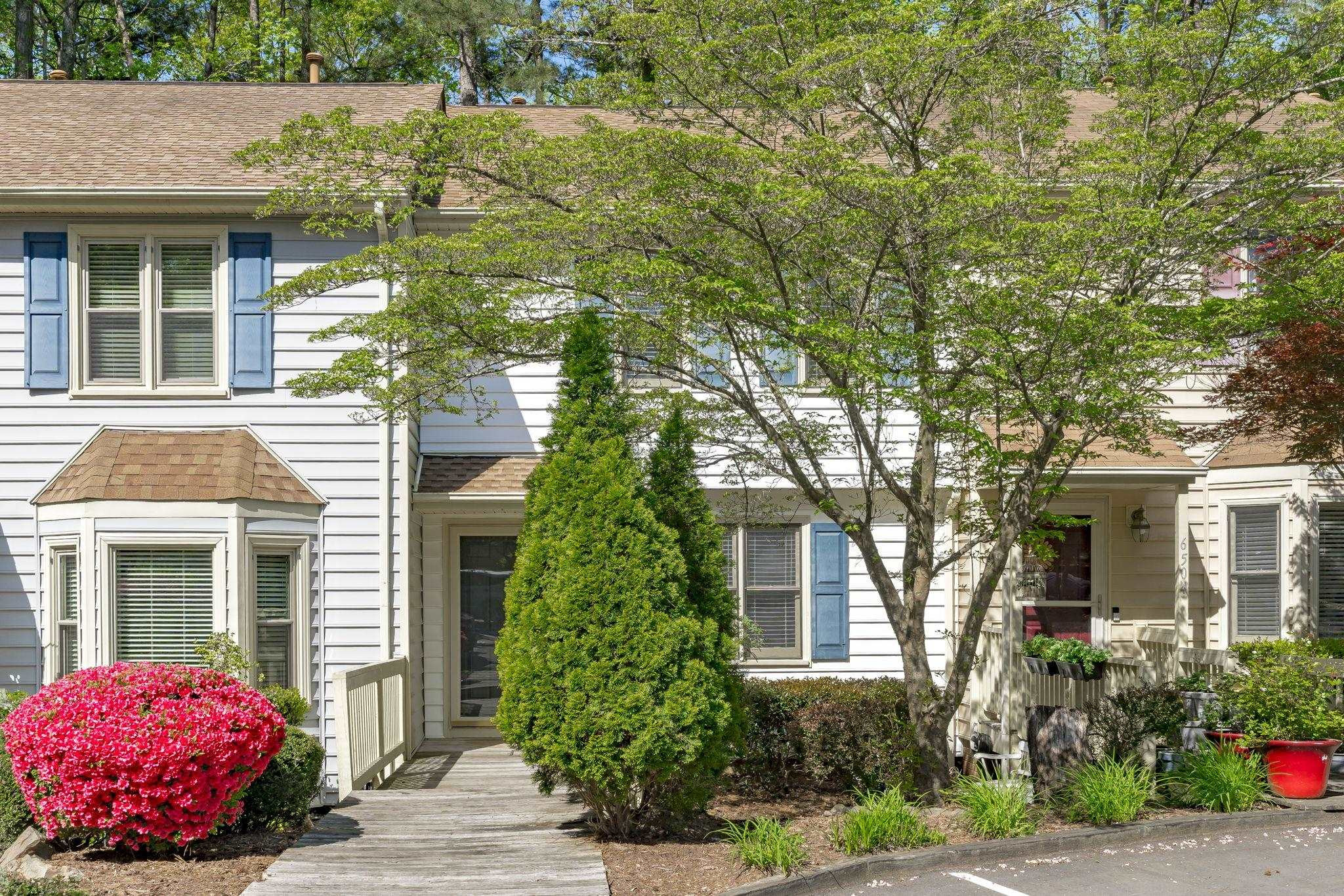 6506 Thetford Court Raleigh, NC 27615 - Photo 2 of 26 a front view of a house with garden