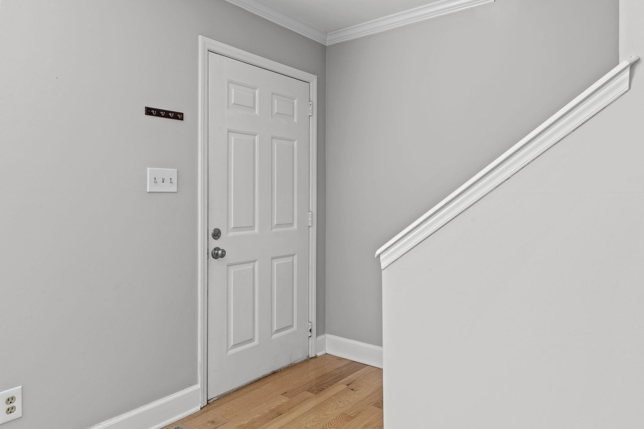6506 Thetford Court Raleigh, NC 27615 - Photo 3 of 26 a view of a hallway with wooden floor