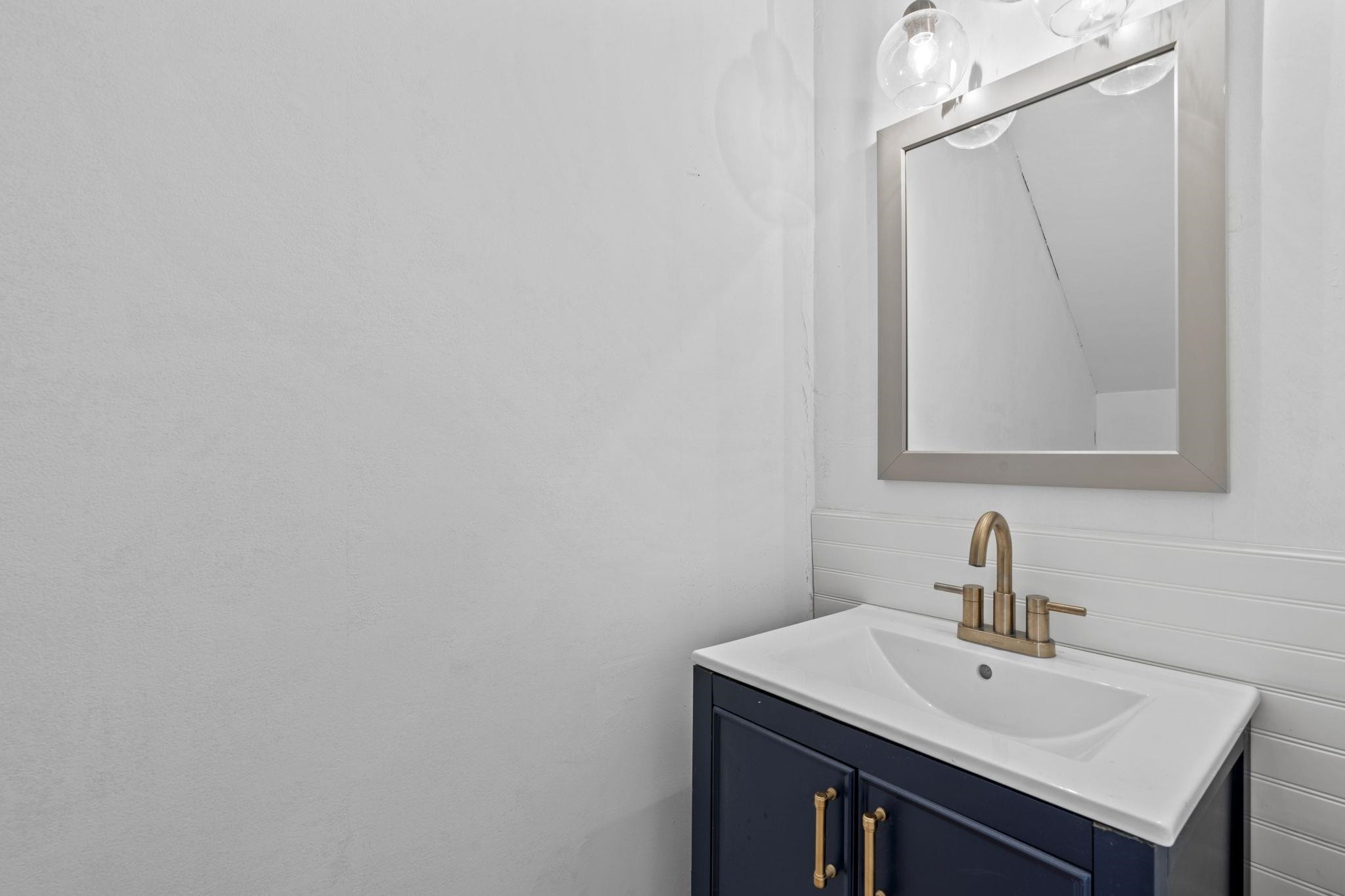 6506 Thetford Court Raleigh, NC 27615 - Photo 7 of 26 a bathroom with a sink and a mirror