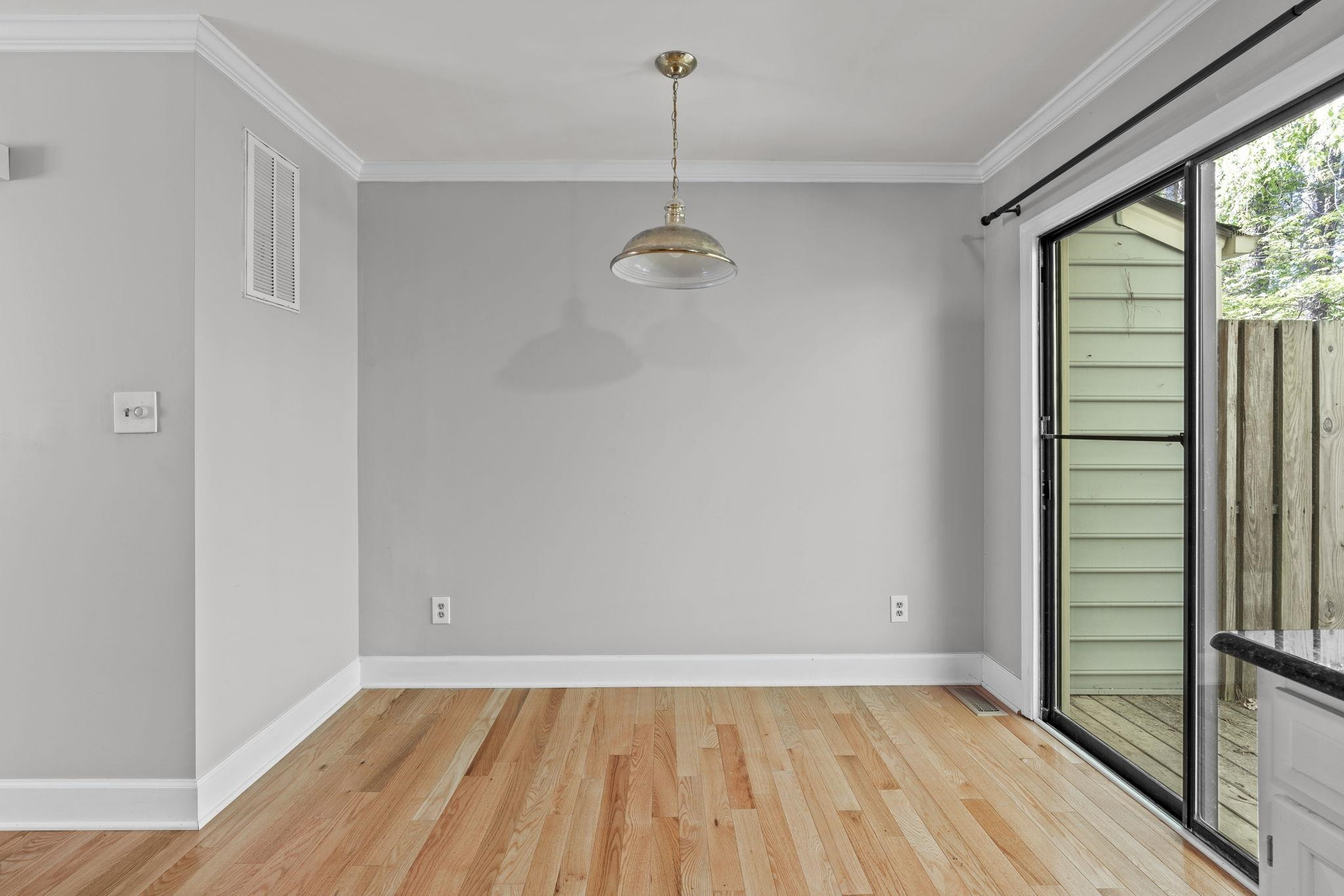 6506 Thetford Court Raleigh, NC 27615 - Photo 9 of 26 a view of empty room with wooden floor and fan
