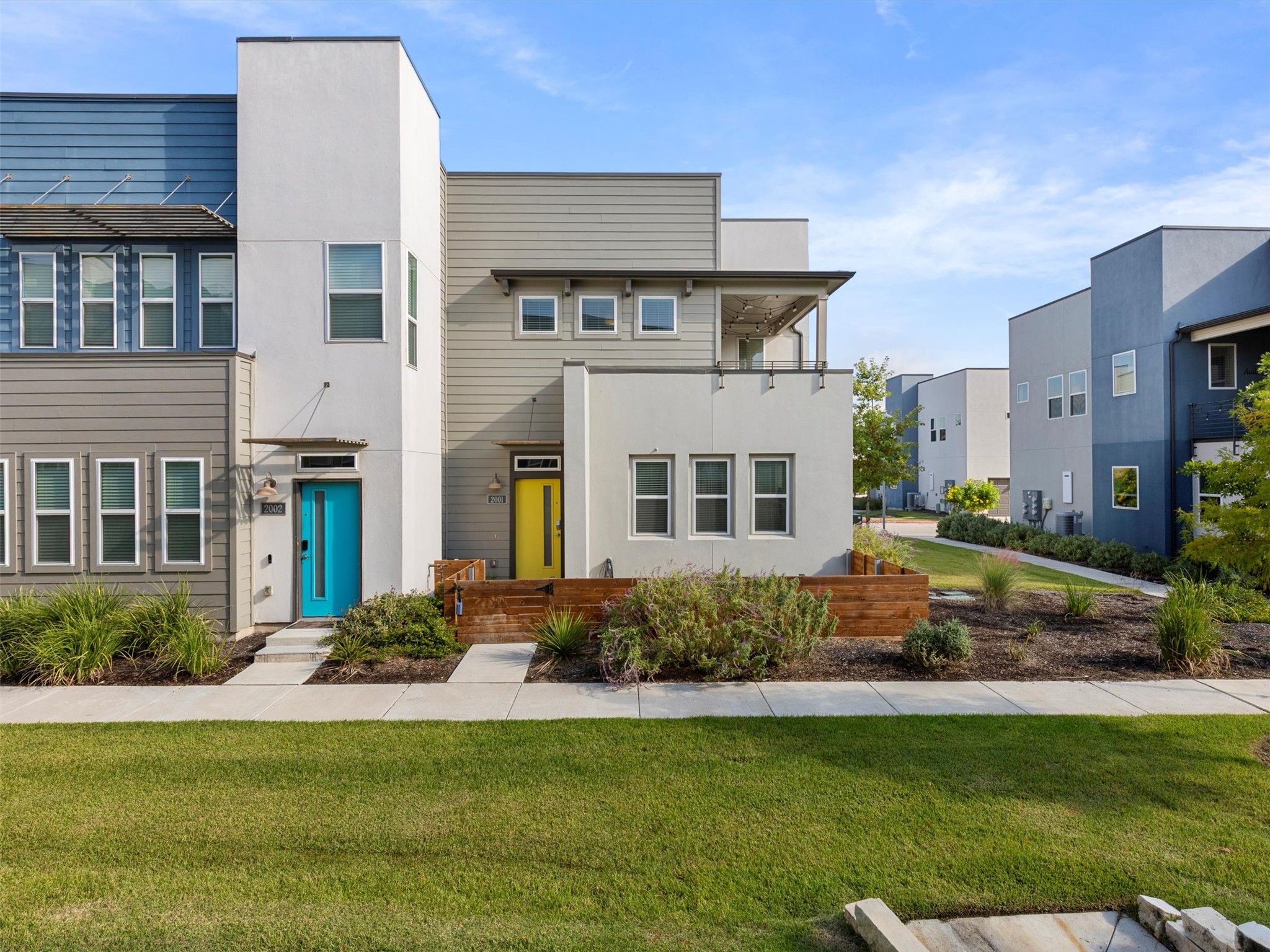 Modern townhome with a expansive beautiful common front lawn