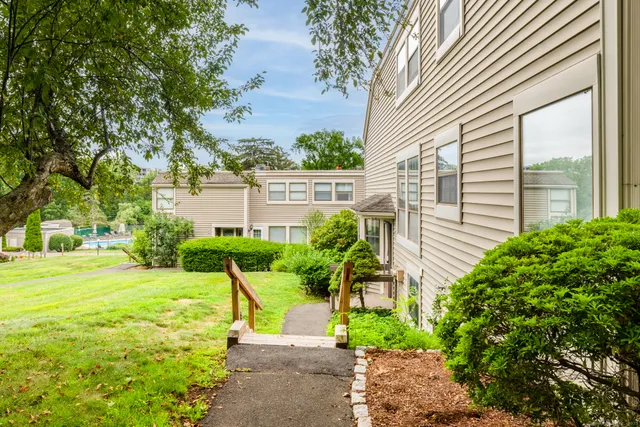 a view of a garden with a house