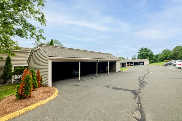 a view of a house with a backyard and porch