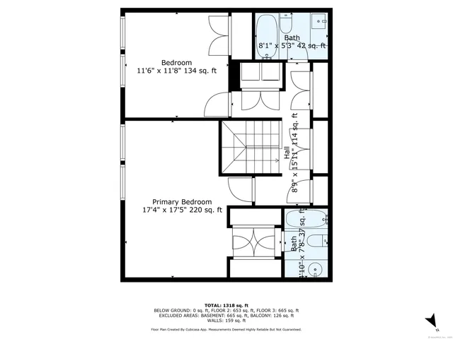 a picture of a rug with a white wall and a picture