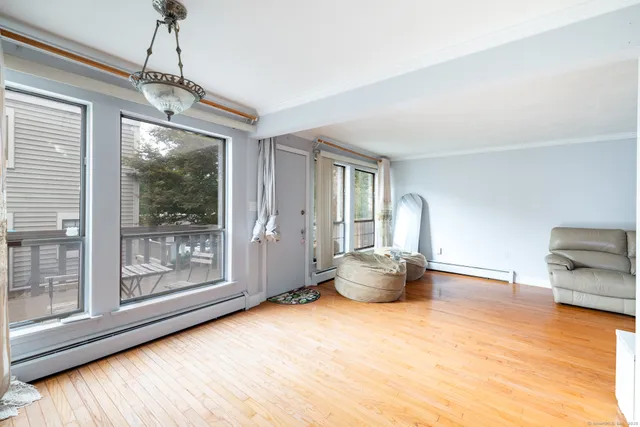 a room with furniture and large windows