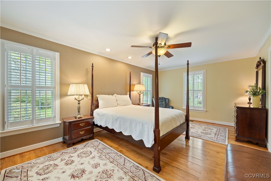 14204 Chimney House Road Midlothian, VA 23112 - Photo 18 of 39 a bedroom with a bed a chandelier and dresser
