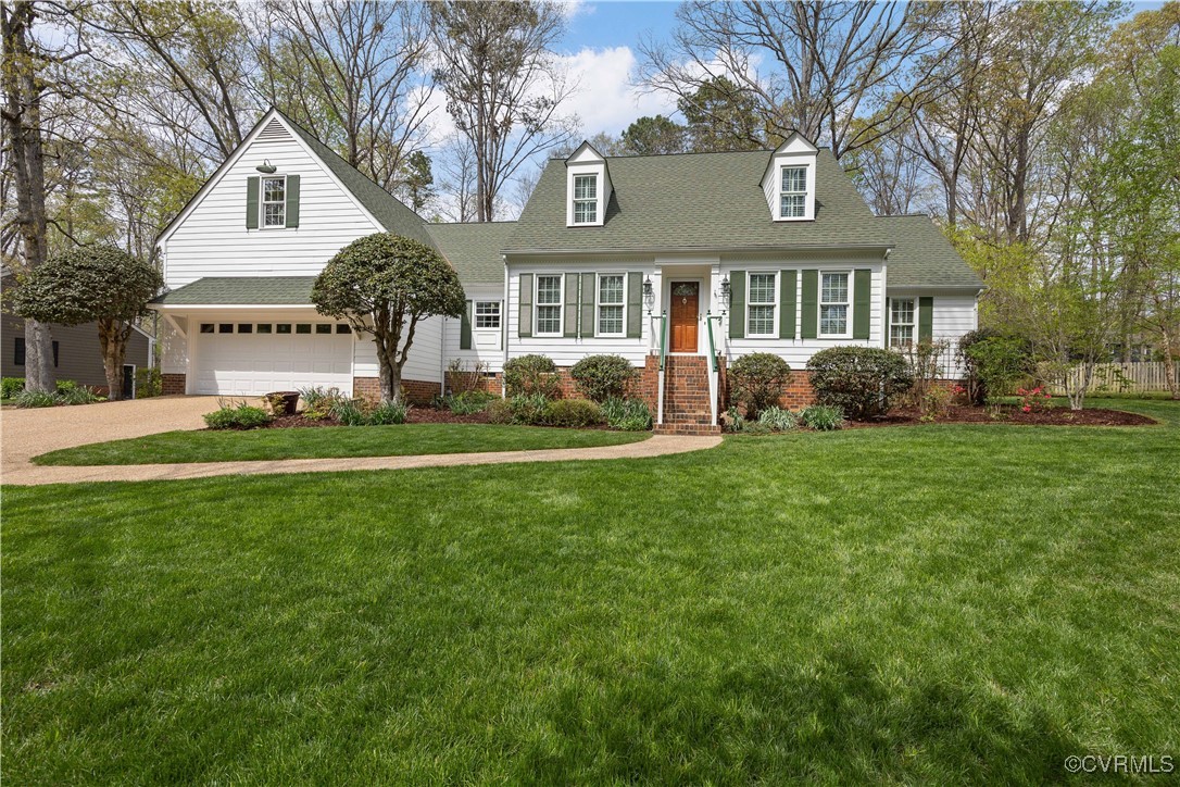 14204 Chimney House Road Midlothian, VA 23112 - Photo 2 of 39 a front view of a house with a yard and trees