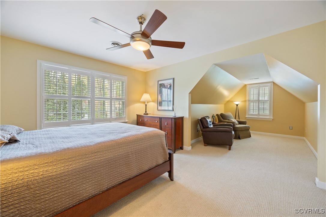 14204 Chimney House Road Midlothian, VA 23112 - Photo 28 of 39 a spacious bedroom with a bed and a chandelier
