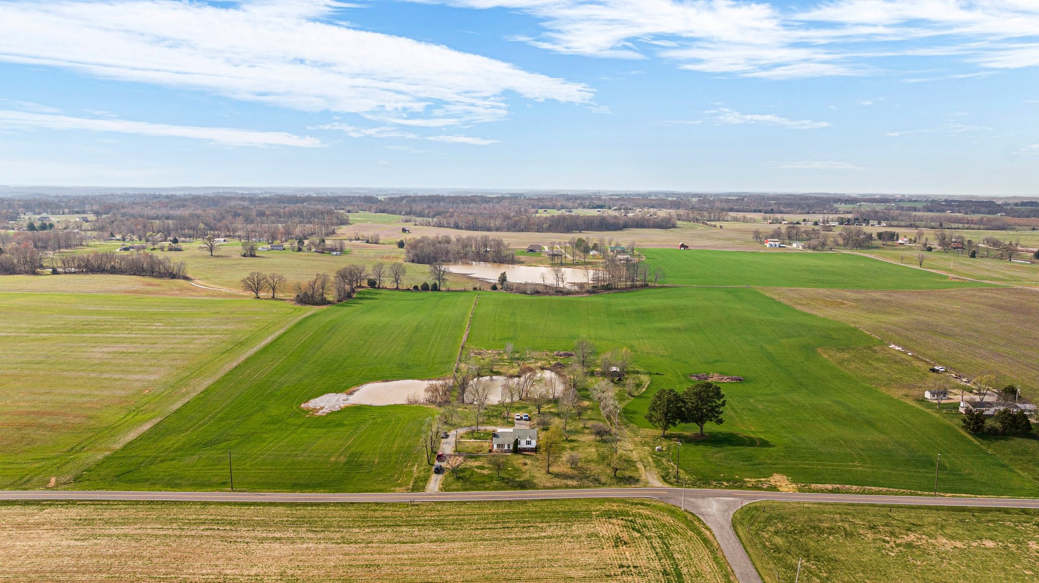 5066 Starks Road Cross Plains, TN 37049 - Photo 1 of 30 a view of a lake with a big yard