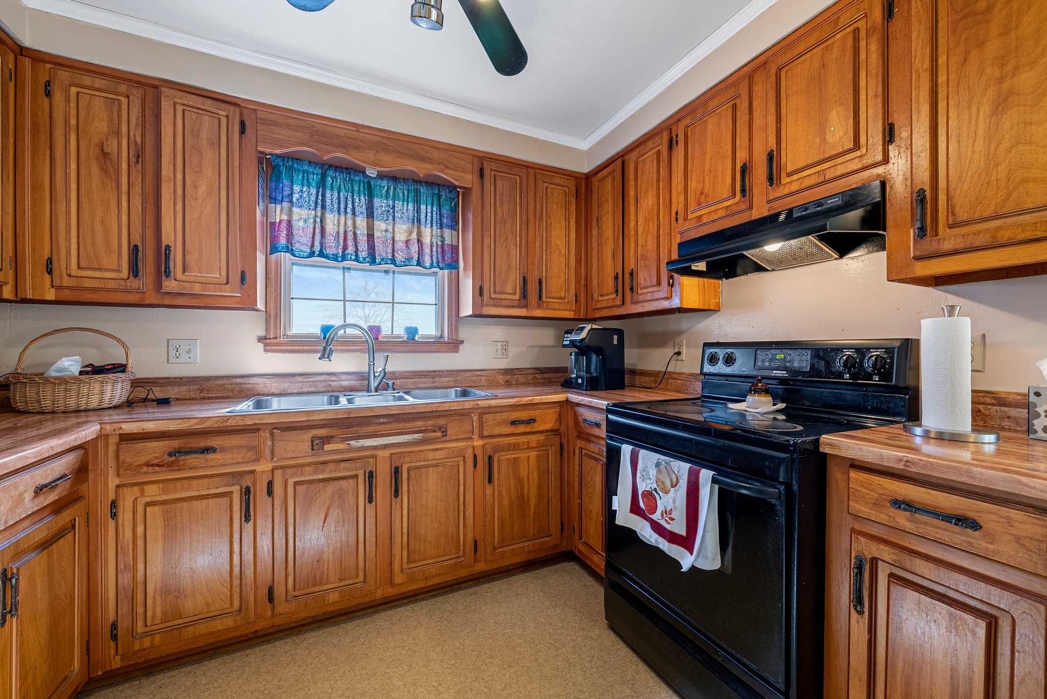 5066 Starks Road Cross Plains, TN 37049 - Photo 19 of 30 a kitchen with granite countertop a stove top oven sink and cabinets