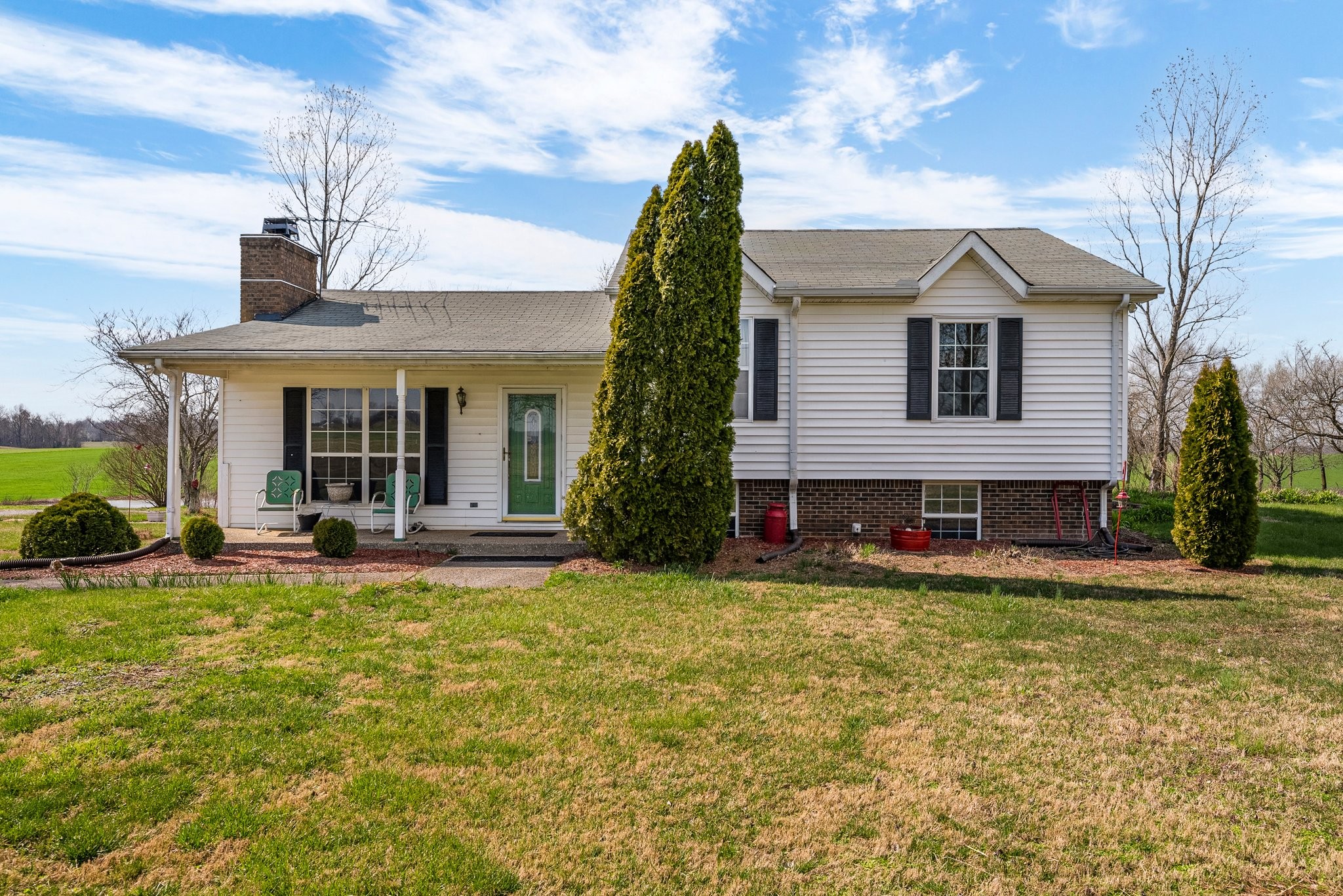 5066 Starks Road Cross Plains, TN 37049 - Photo 2 of 30 a view of a house with a yard patio and fire pit