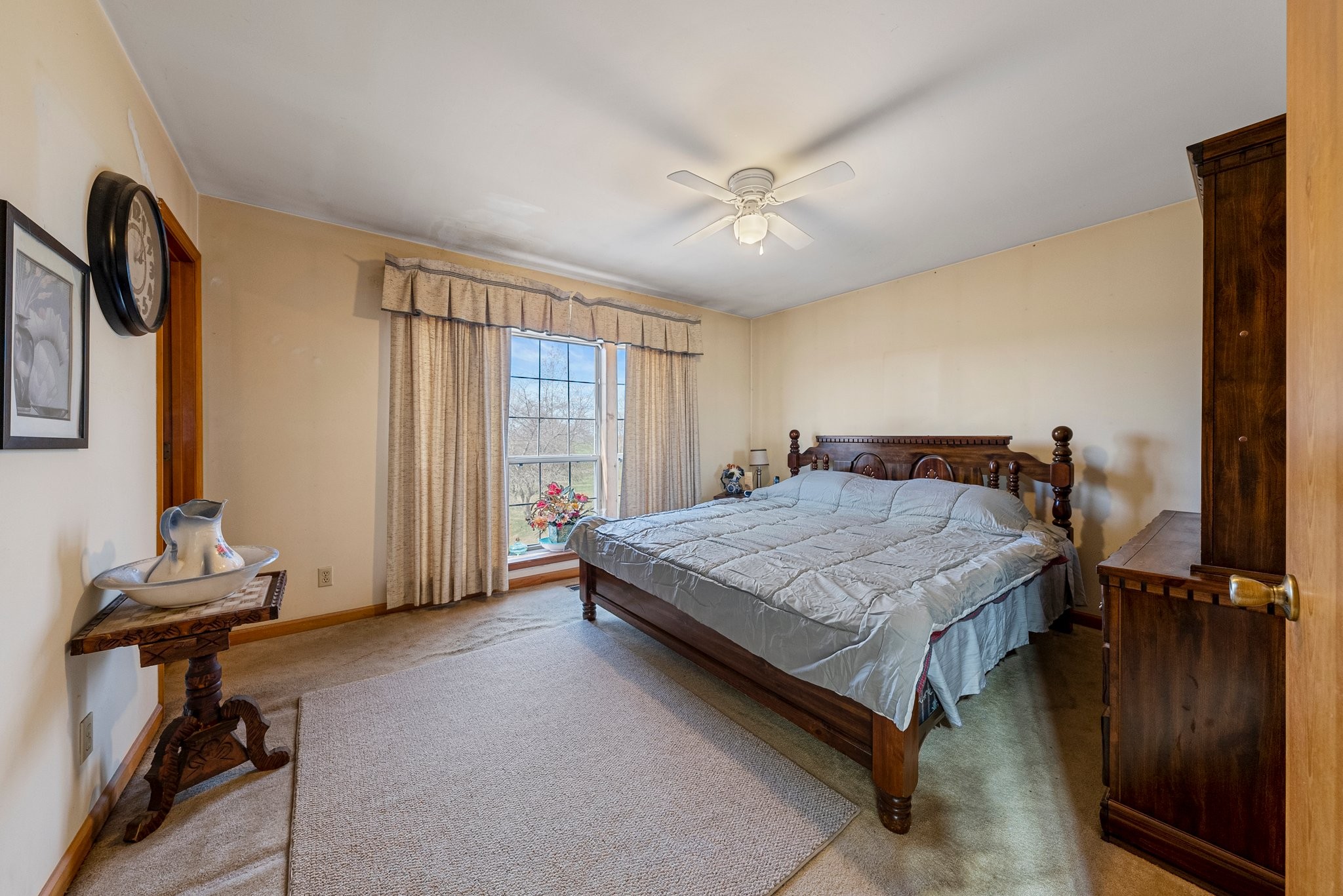 5066 Starks Road Cross Plains, TN 37049 - Photo 25 of 30 a bedroom with a bed and a chandelier