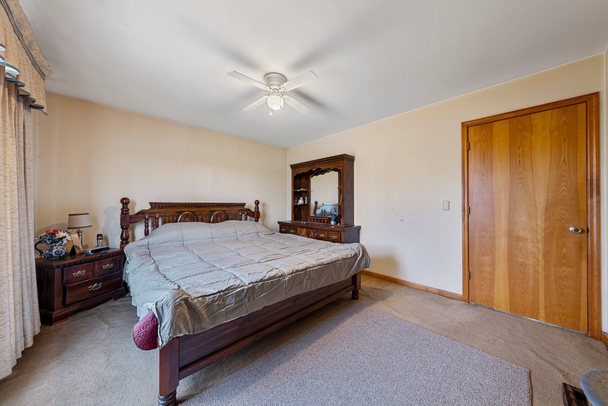 5066 Starks Road Cross Plains, TN 37049 - Photo 26 of 30 a bedroom with a bed and a chandelier