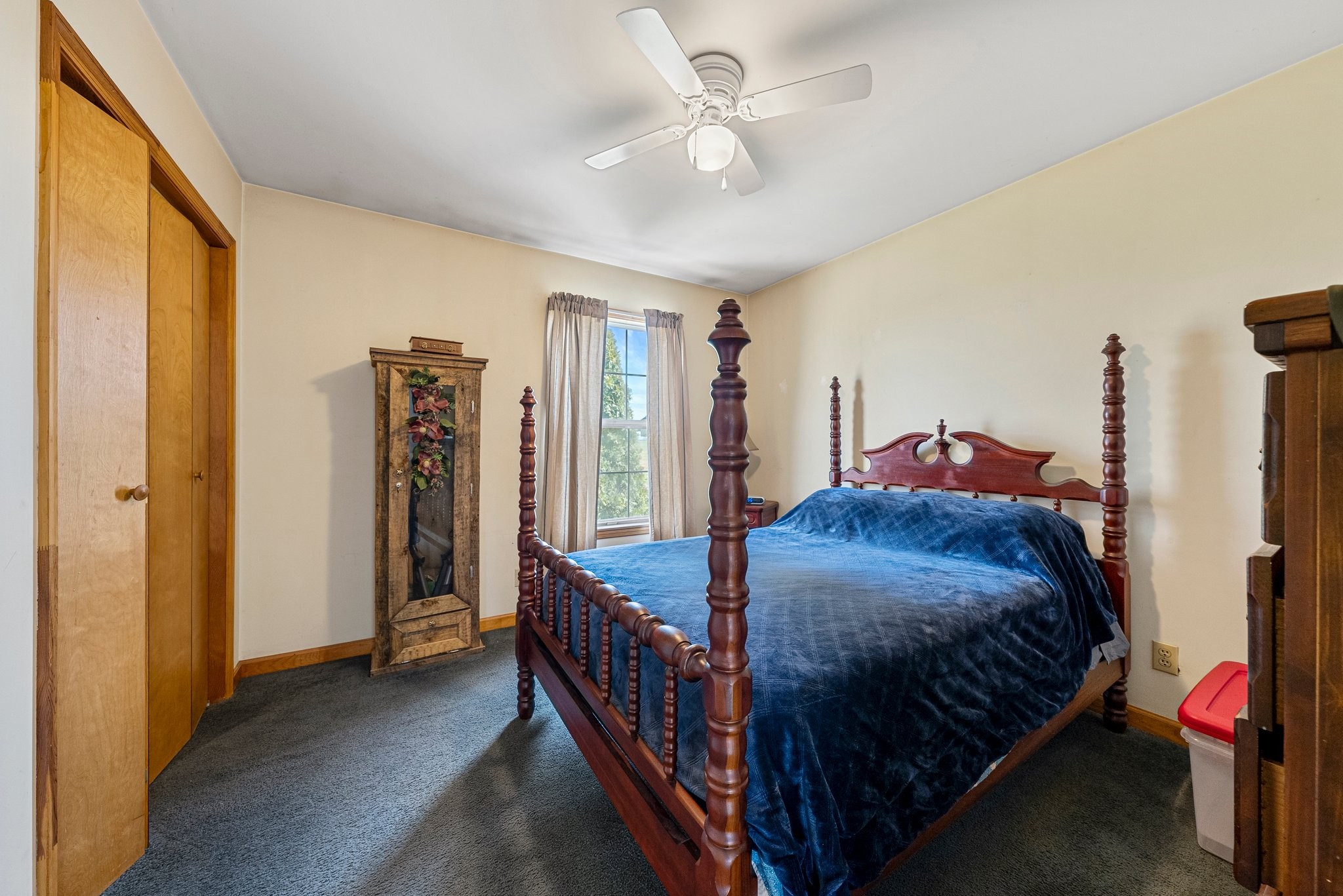 5066 Starks Road Cross Plains, TN 37049 - Photo 27 of 30 a bedroom with a bed and a chandelier