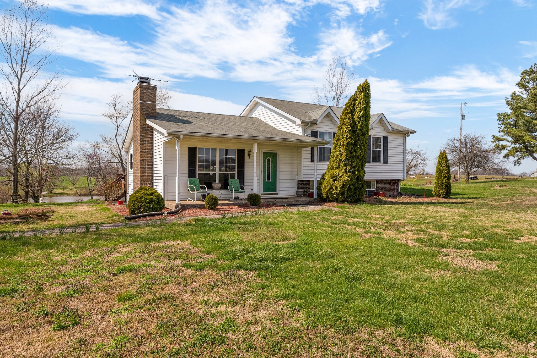 5066 Starks Road Cross Plains, TN 37049 - Photo 3 of 30 a view of a house with a big yard and large trees