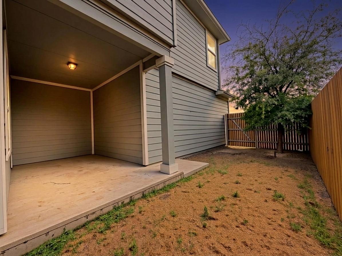 10502 Fulton Avenue Austin, TX 78754 - Photo 33 of 36 A private covered patio and fenced yard create an ideal outdoor living space.