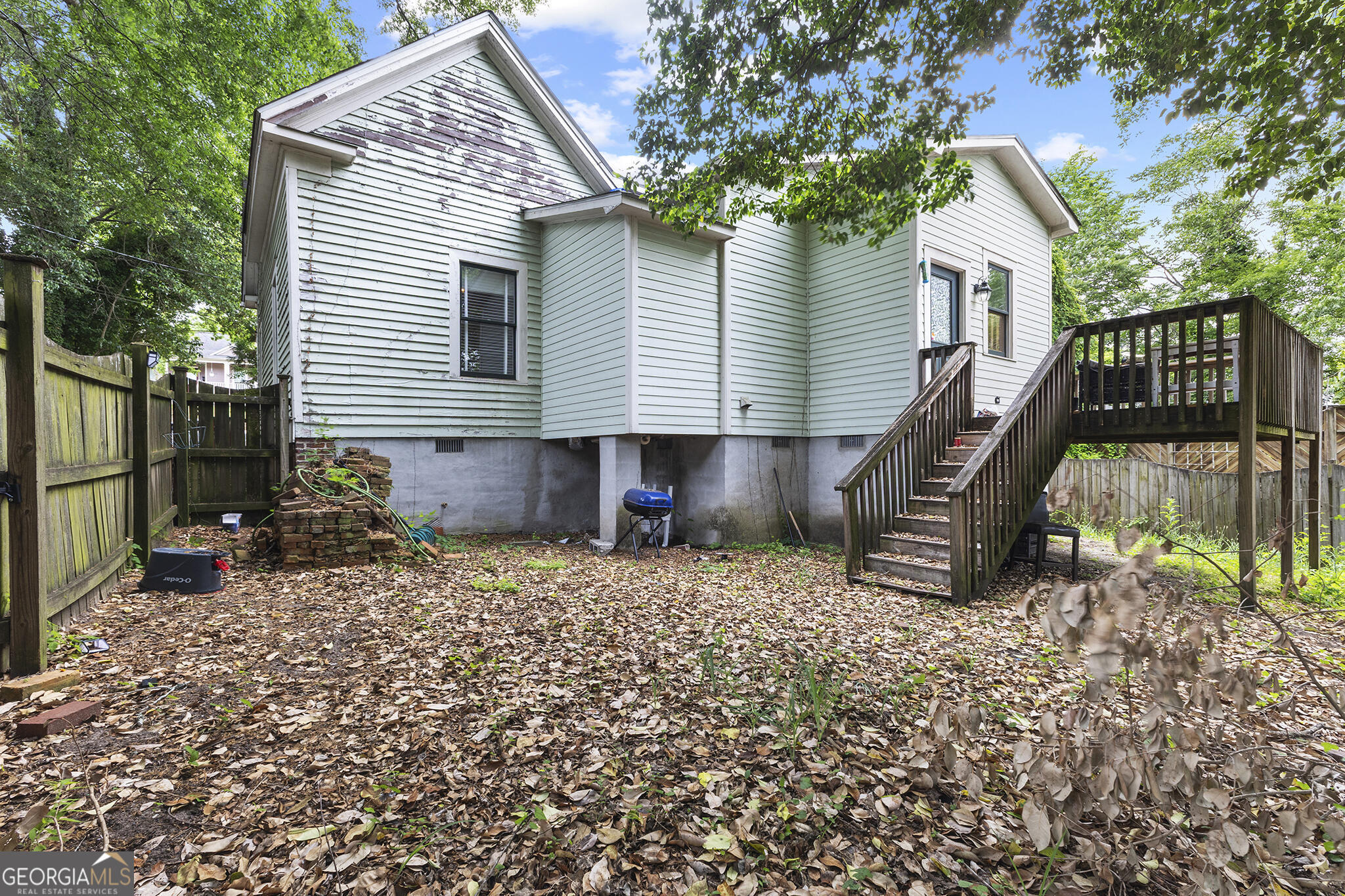 1469 Chestnut Street Macon, GA 31201 - Photo 25 of 26 a view of a house with backyard and a tree
