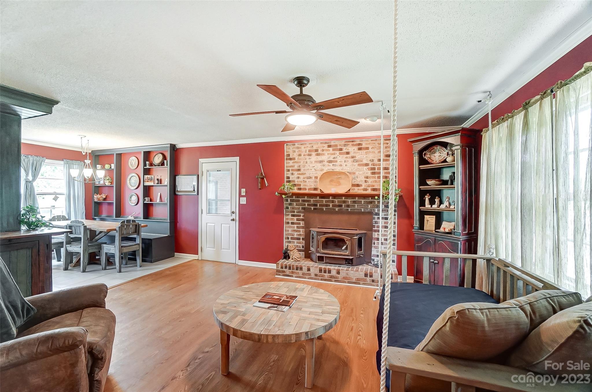 1508 Fletcher Broome Road Monroe, NC 28112 - Photo 7 of 46 a living room with furniture a fireplace and a large window