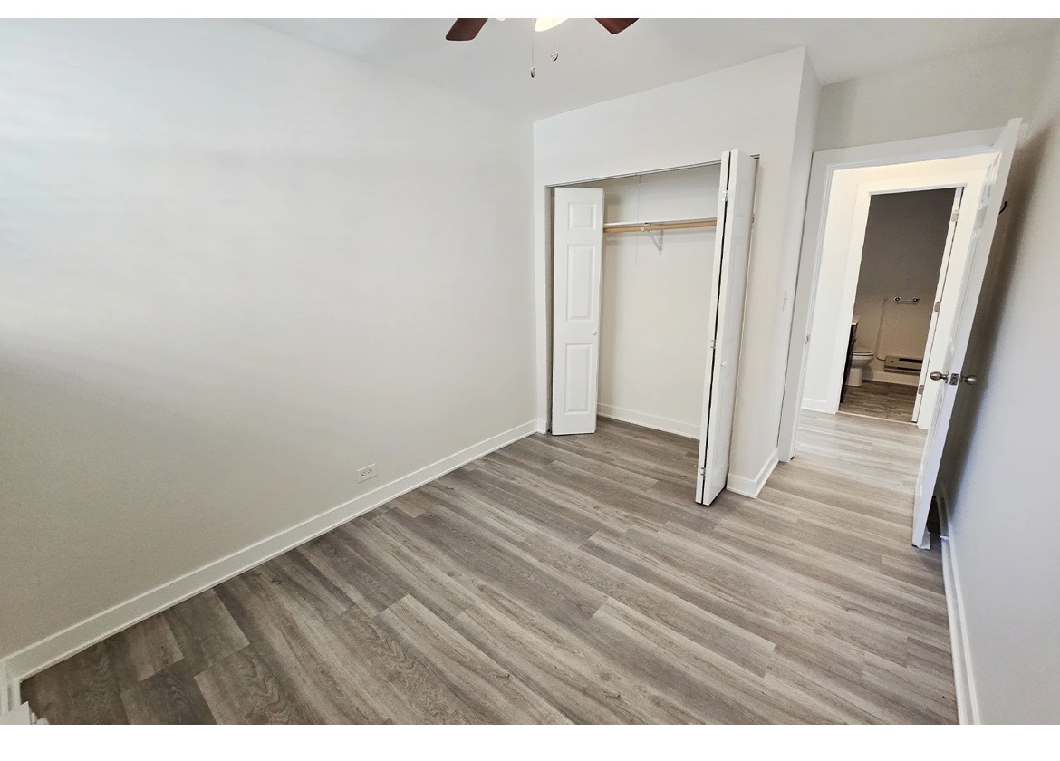 732 West Roscoe Street, Unit SGA Chicago, IL 60657 - Photo 11 of 13 a view of a room with wooden floor