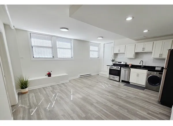 a view of kitchen with wooden floor